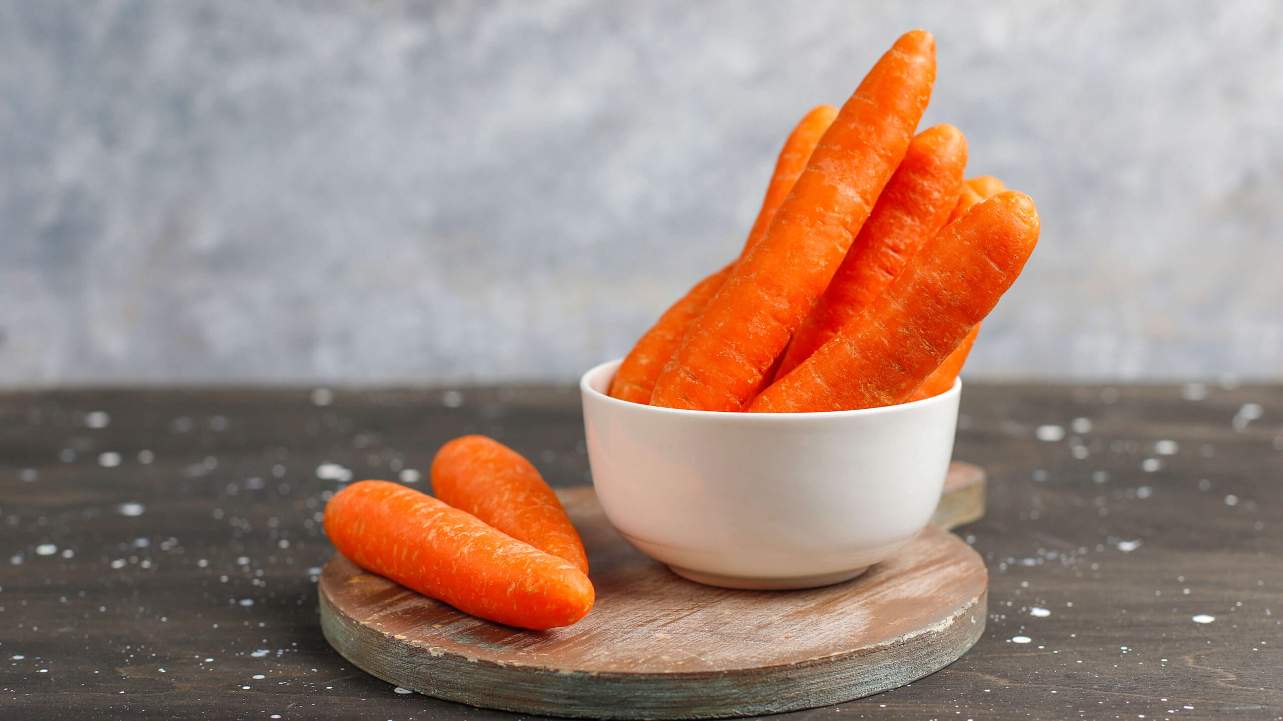 orange carrots in a white    bowl